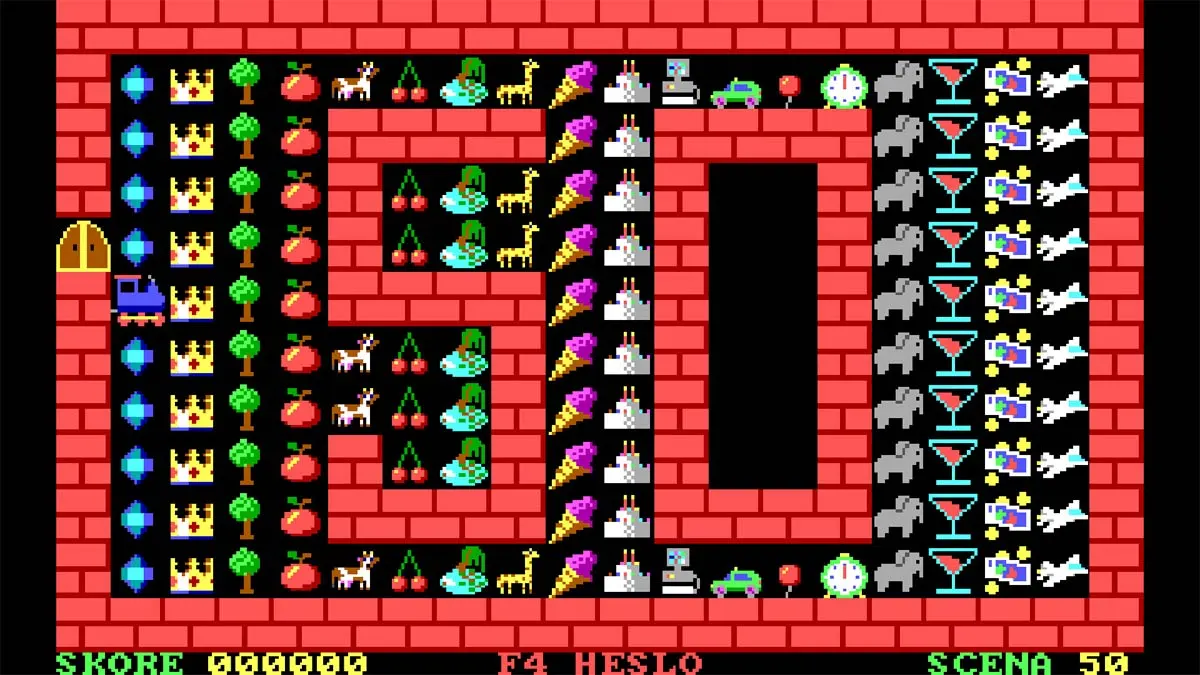 Screen z darmowej retro gry VLAK. Pokazuje planszę z pociągiem i owocami/przedmiotami do zebrania.